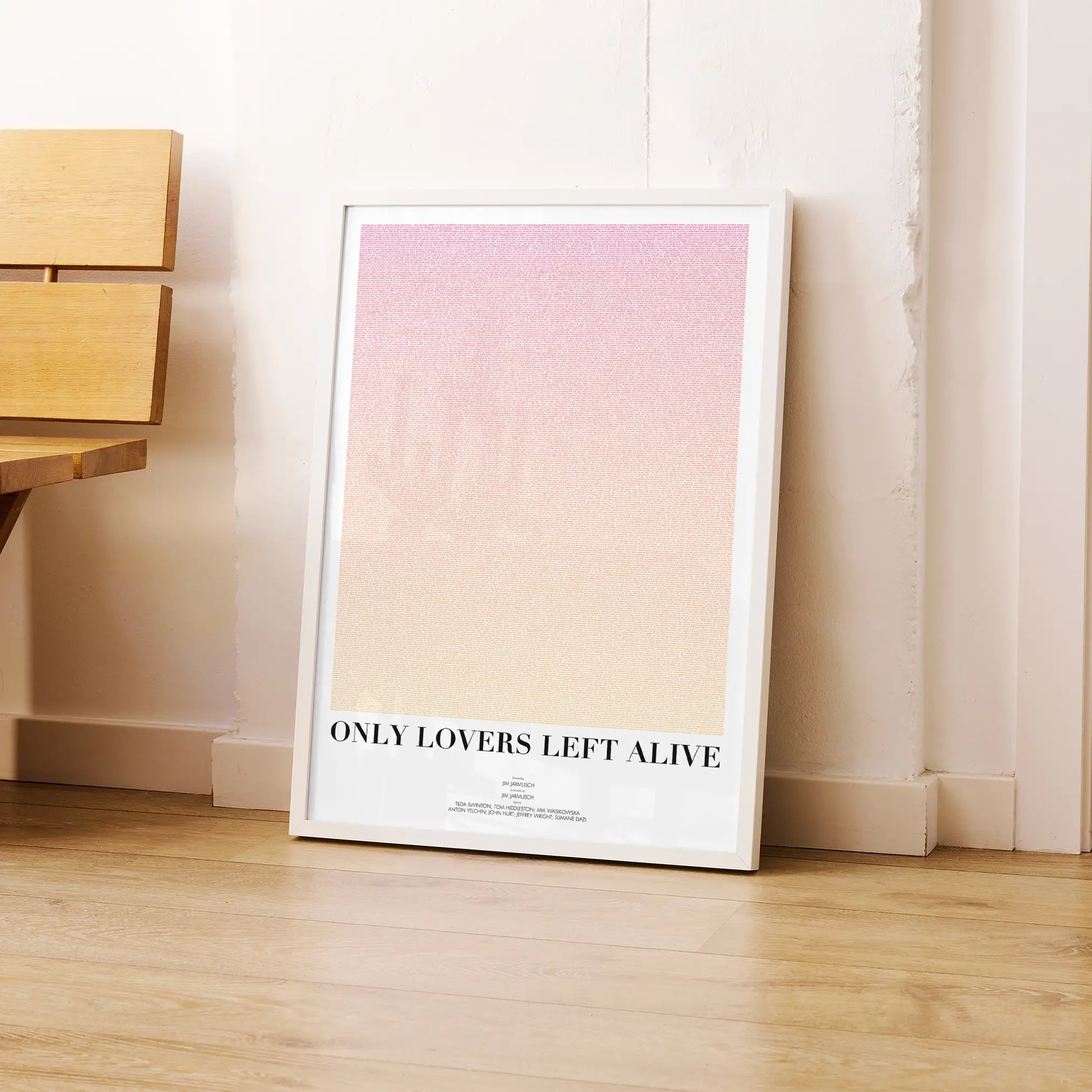 A framed Only Lovers Left Alive movie script poster leaning against a wall in a modern interior.