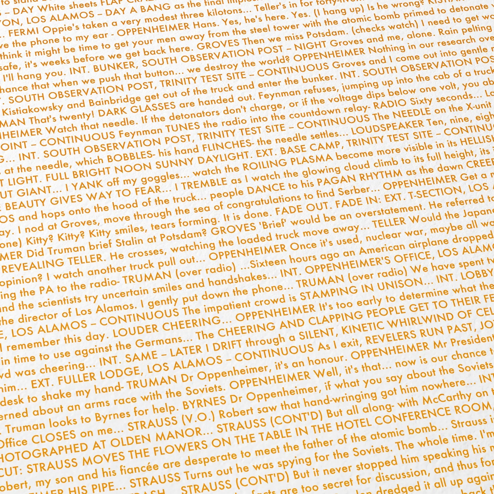 Close-up detail of the Oppenheimer movie script poster showing dense typographic text.