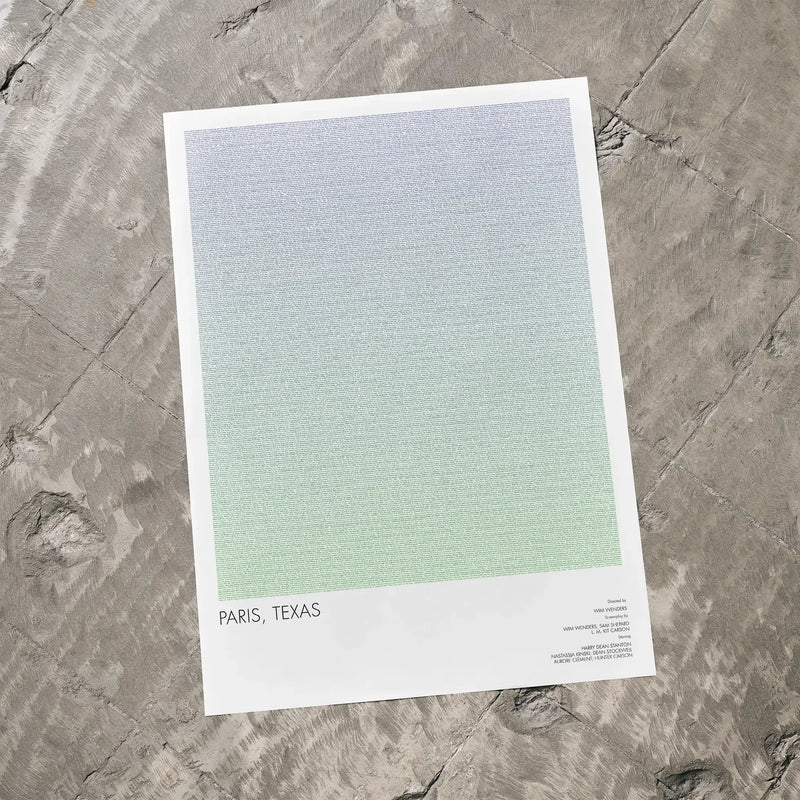 A Paris, Texas movie print lays on a concrete floor.