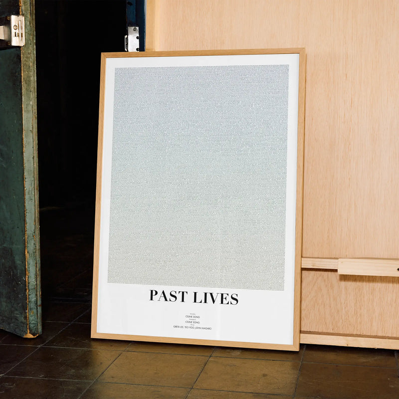 A framed Past Lives movie script poster displayed in a contemporary interior setting.