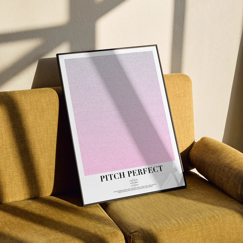 A framed Pitch Perfect movie script poster styled in a clean interior setting.