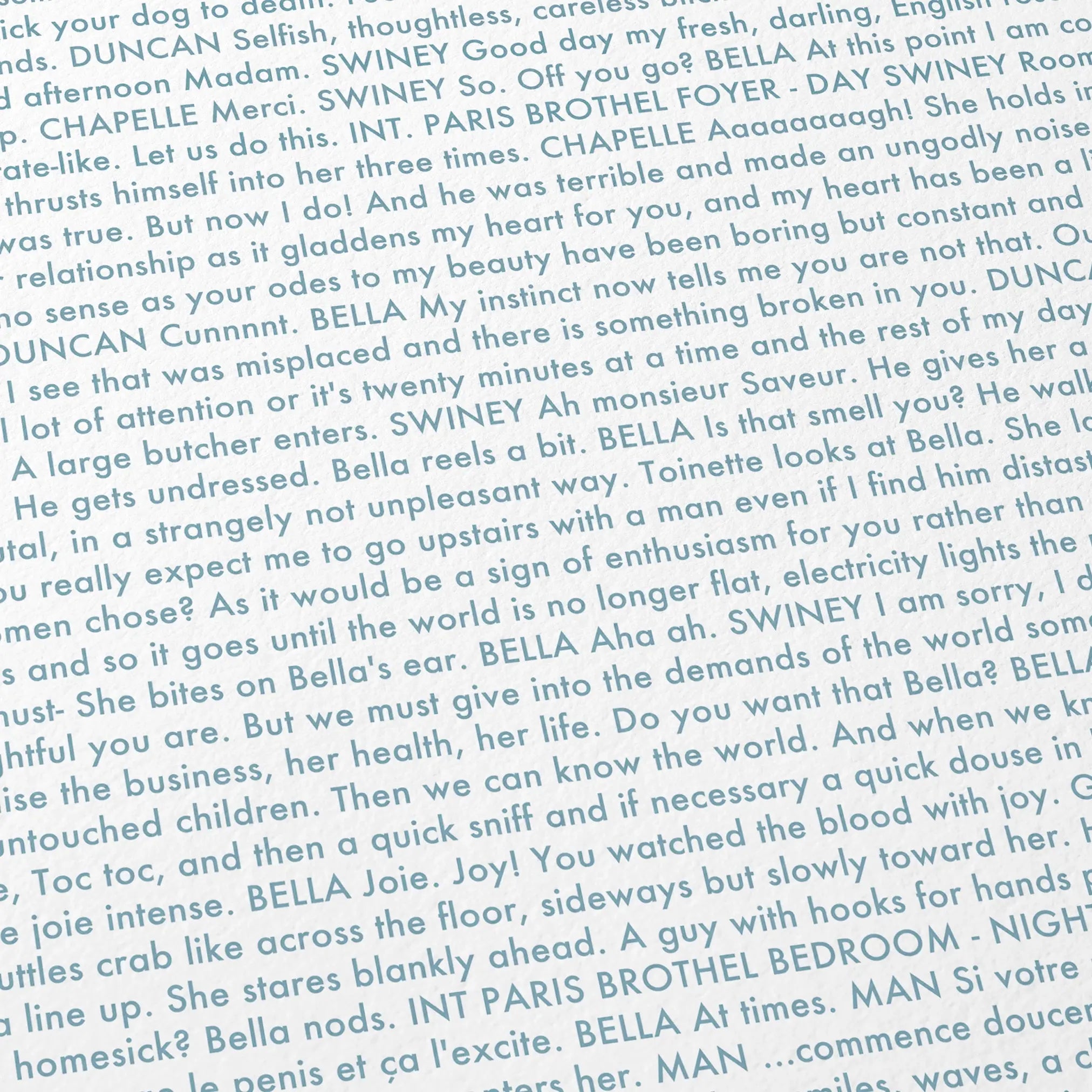 Close-up detail of the Poor Things movie script poster showing dense typographic text.