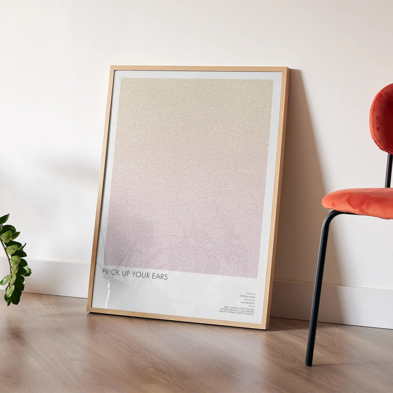 A framed Prick Up Your Ears movie script poster placed in a bright interior environment.