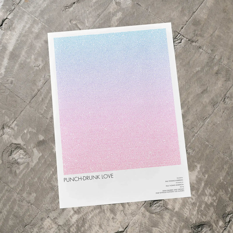 A Punch-Drunk Love movie script poster laid flat on a textured floor surface.