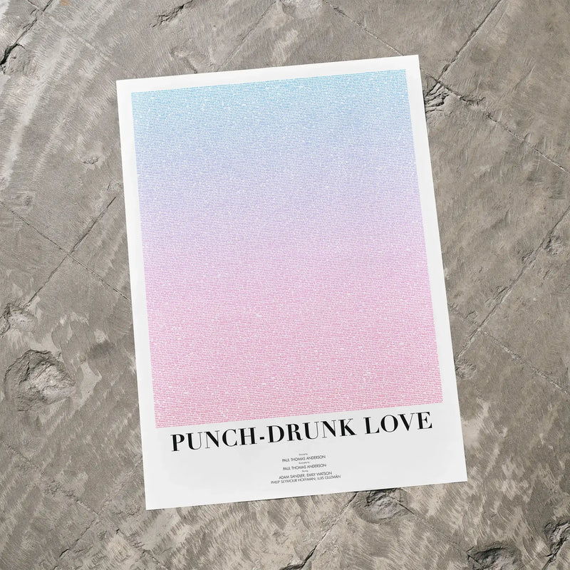 A Punch-Drunk Love movie script poster laid flat on a textured floor surface.