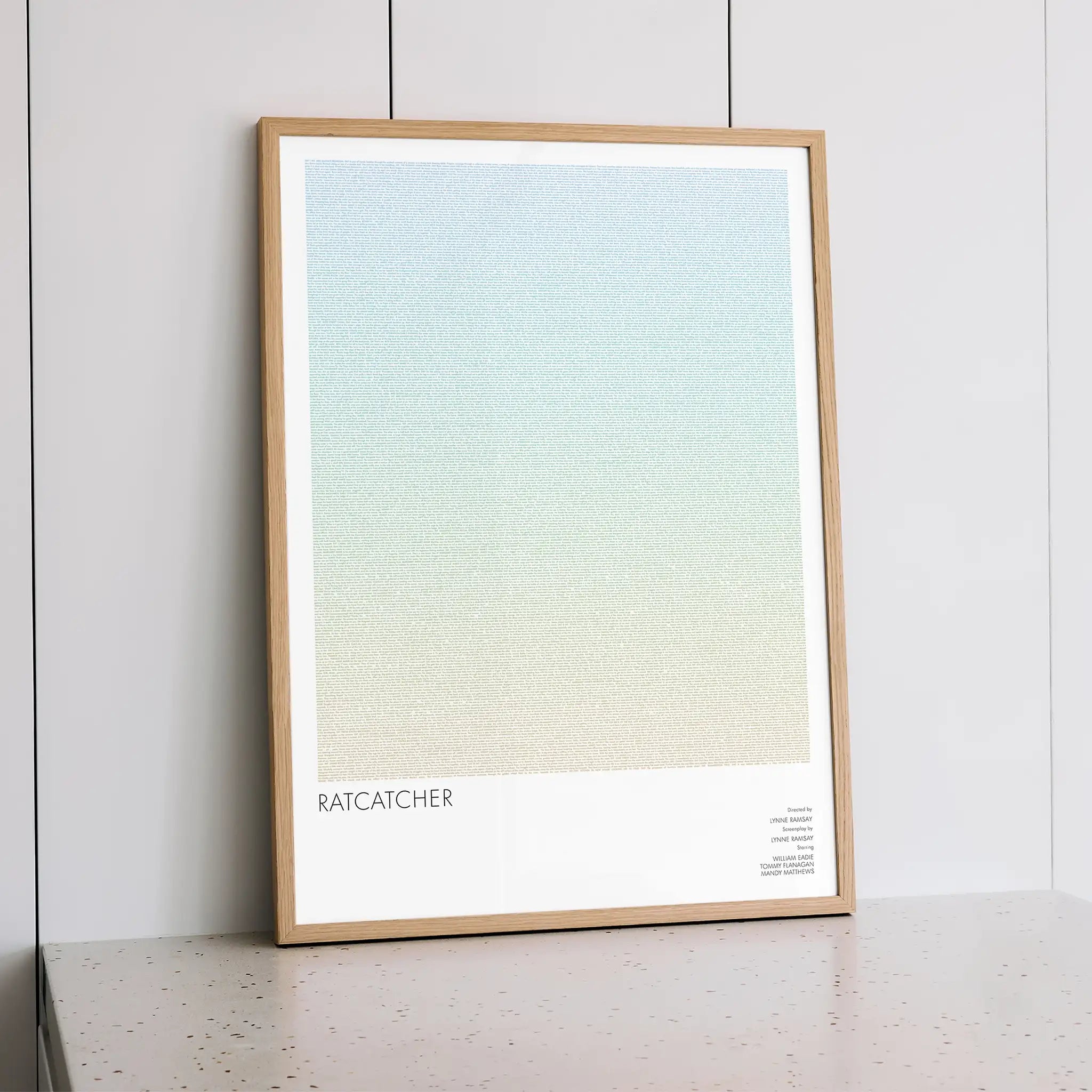 Framed "Ratcatcher" artwork with a gradient design on a white wall