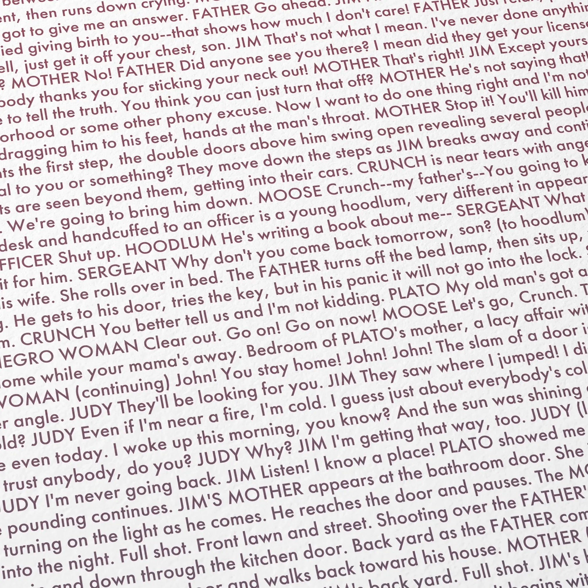 Close-up detail of the Rebel Without a Cause movie script poster showing dense typographic text.