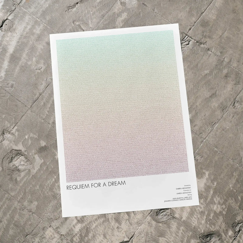 A Requiem for a Dream movie script poster laid flat on a textured floor surface.
