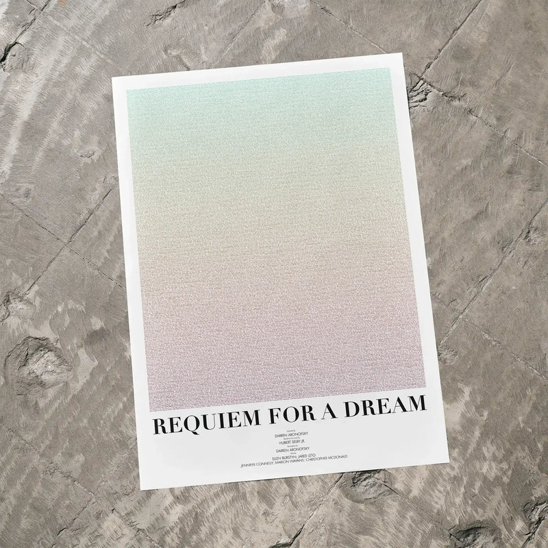 A Requiem for a Dream movie script poster laid flat on a textured floor surface.