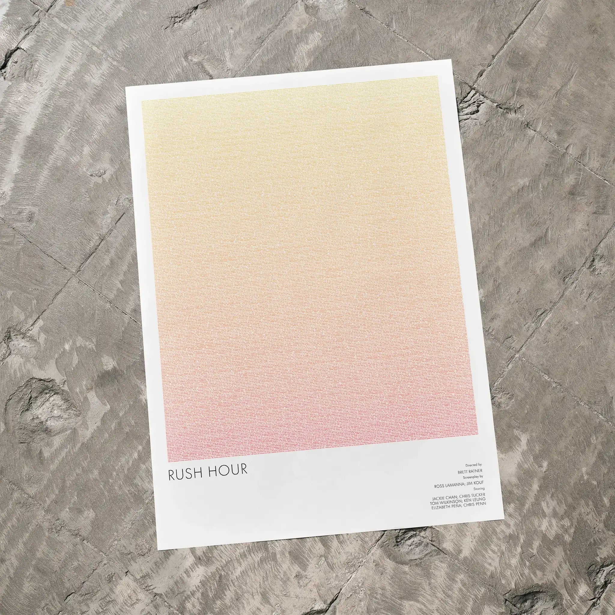 A Rush Hour movie script poster laid flat on a textured floor surface.