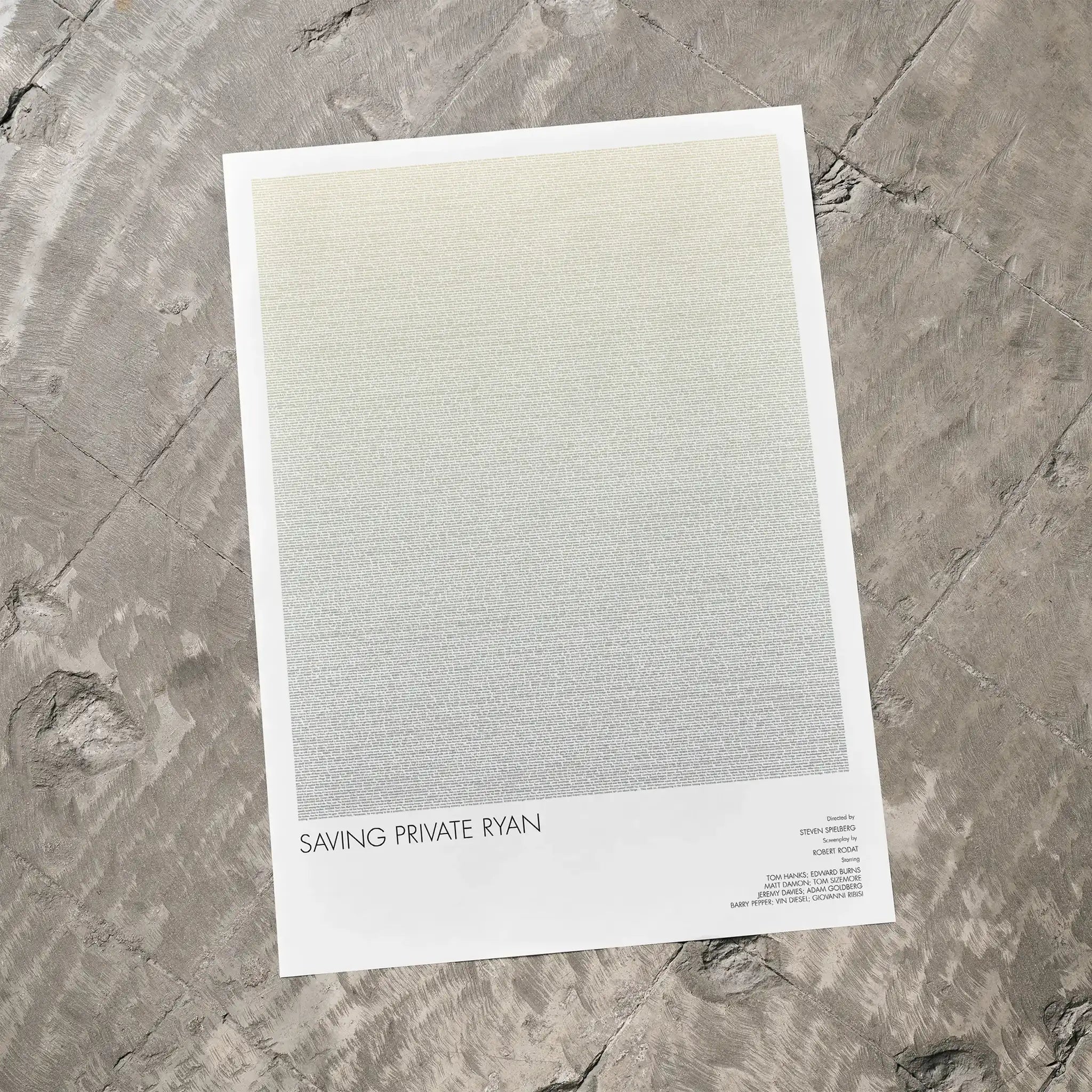 A Saving Private Ryan movie script poster laid flat on a textured floor surface.