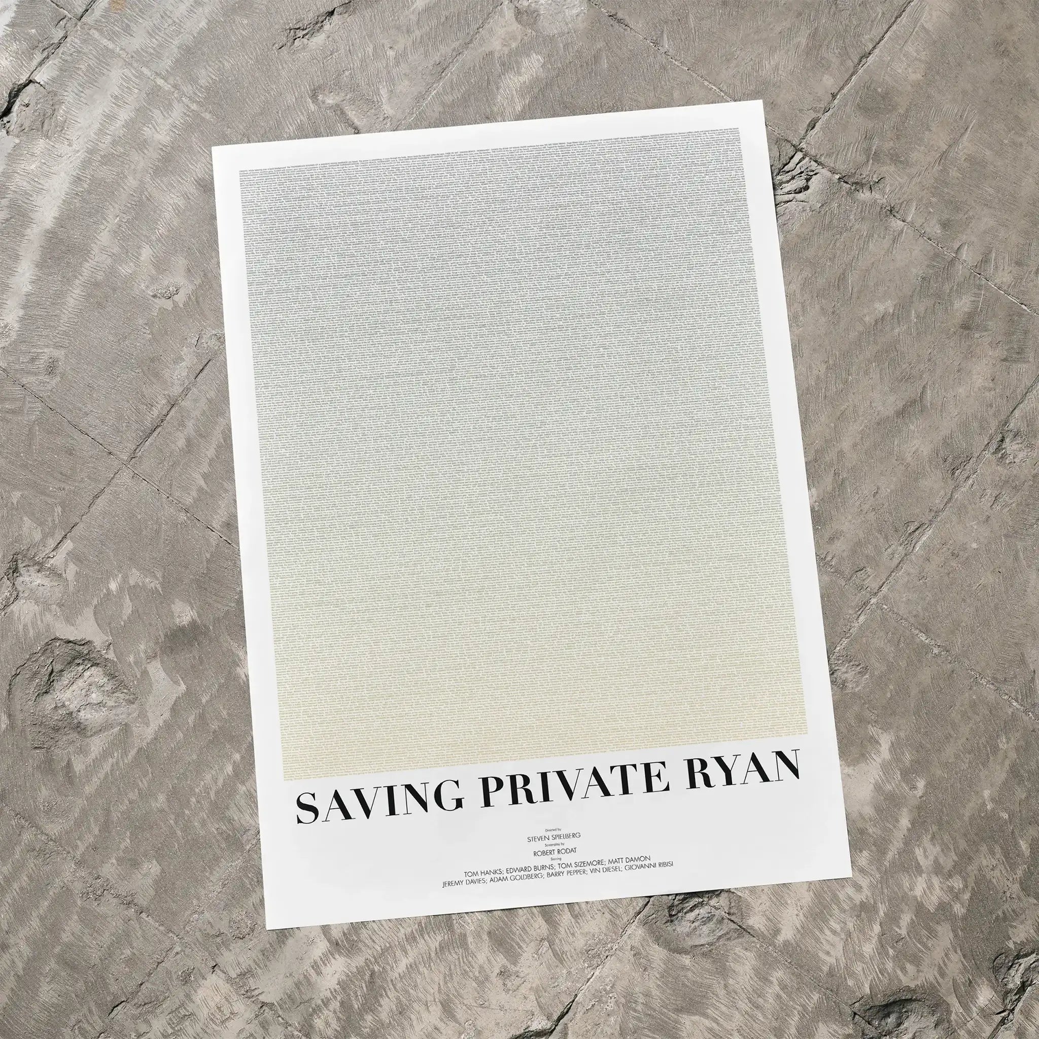 A Saving Private Ryan movie script poster laid flat on a textured floor surface.