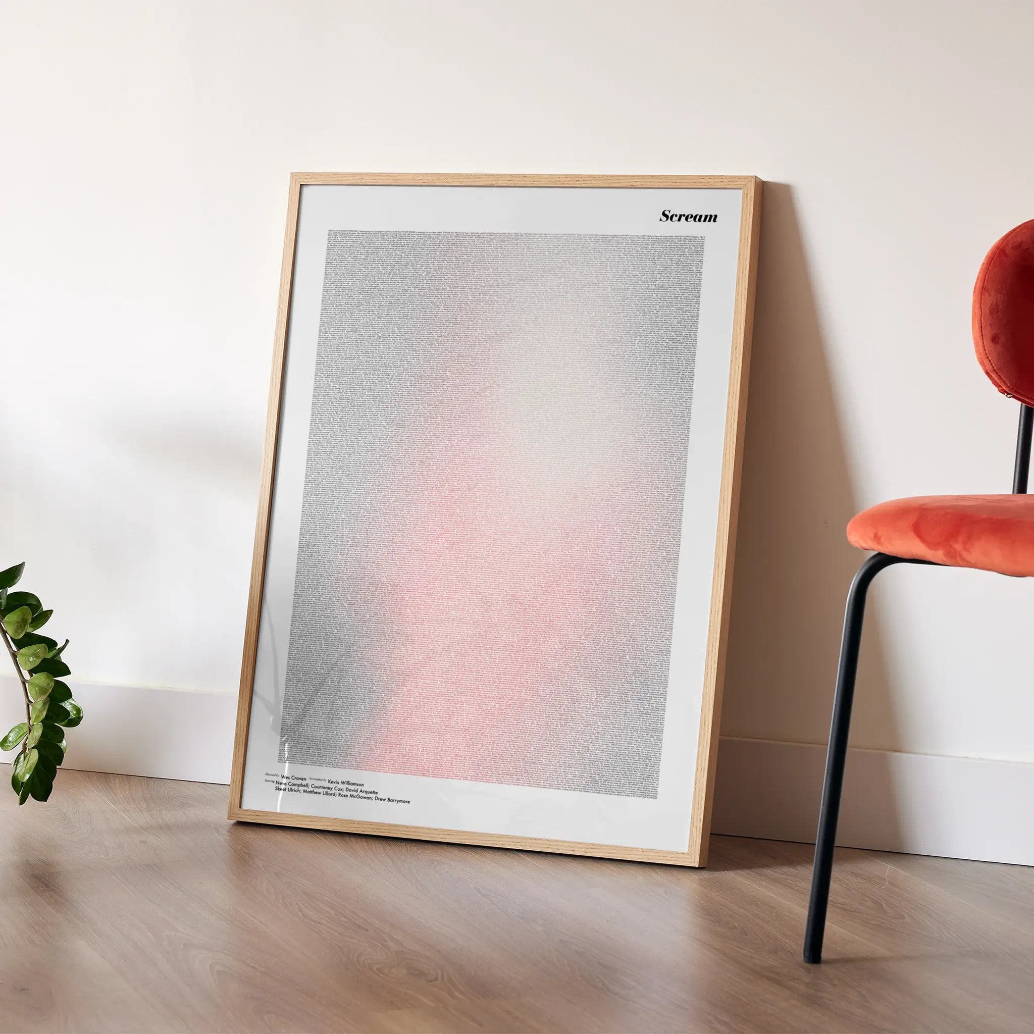 A framed Scream movie script poster placed in a bright interior environment.