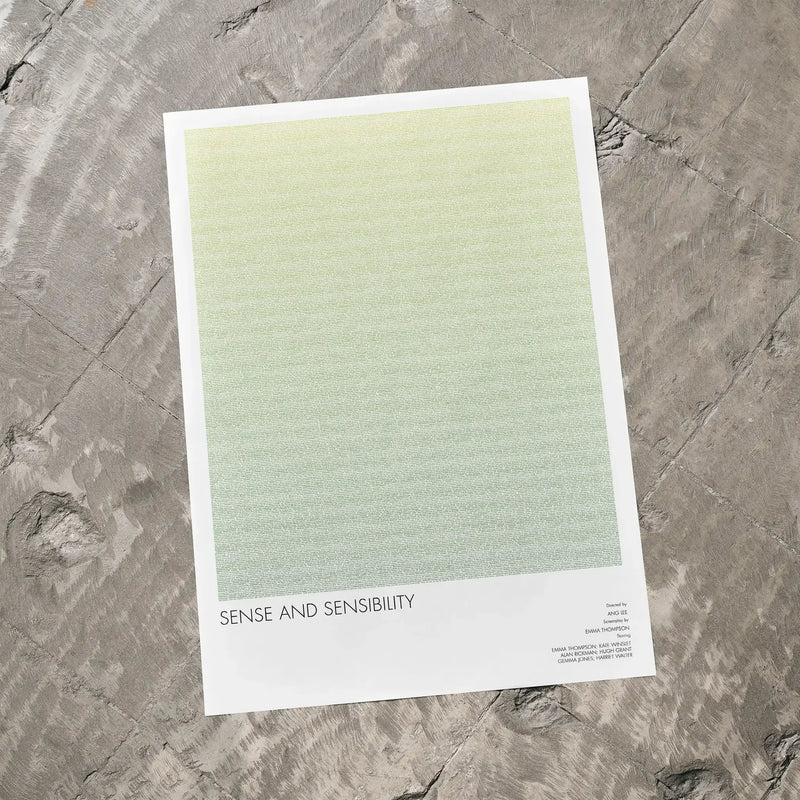 Movie poster of 'Sense and Sensibility' on a textured gray surface