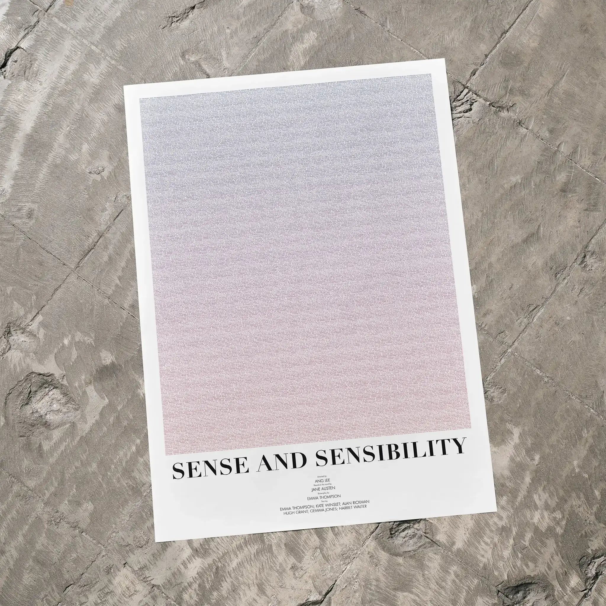 A Sense and Sensibility movie script poster laid flat on a textured floor surface.