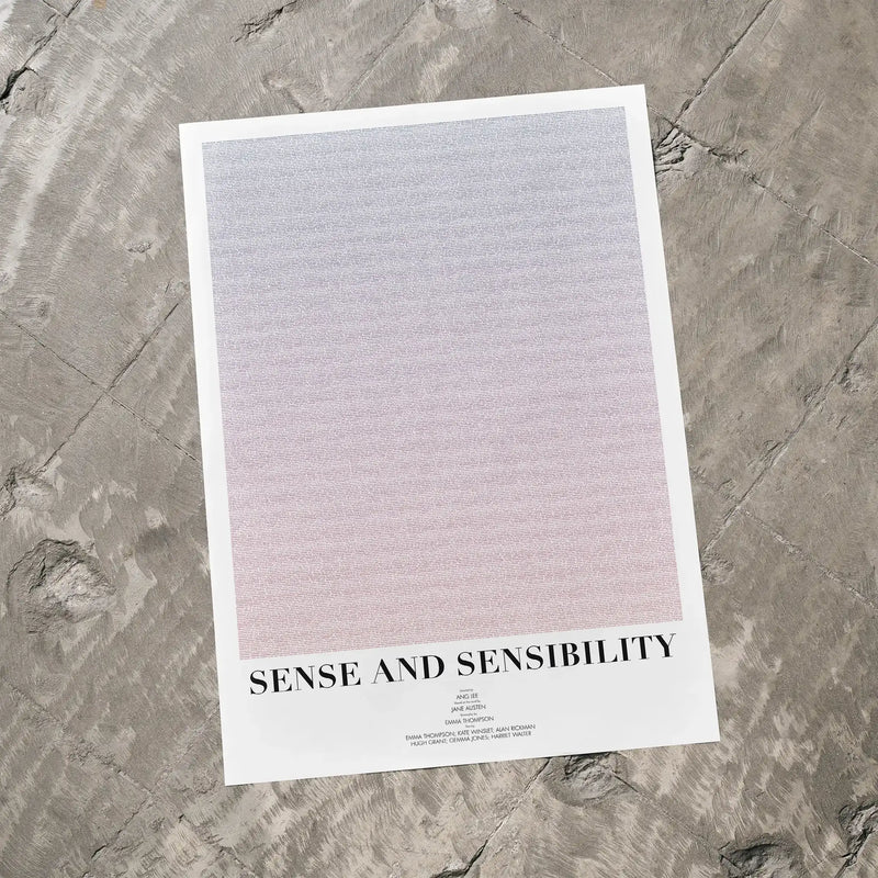 A Sense and Sensibility movie script poster laid flat on a textured floor surface.