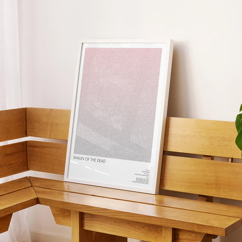 A framed Shaun of the Dead movie script poster displayed on a sideboard in a contemporary space.