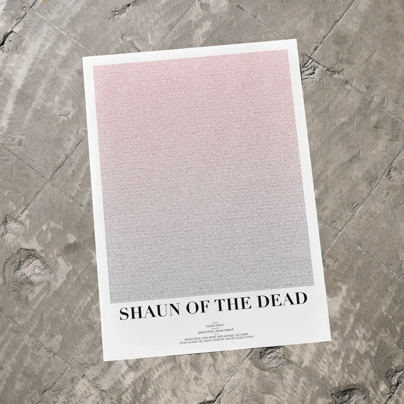 A Shaun of the Dead movie script poster laid flat on a textured floor surface.