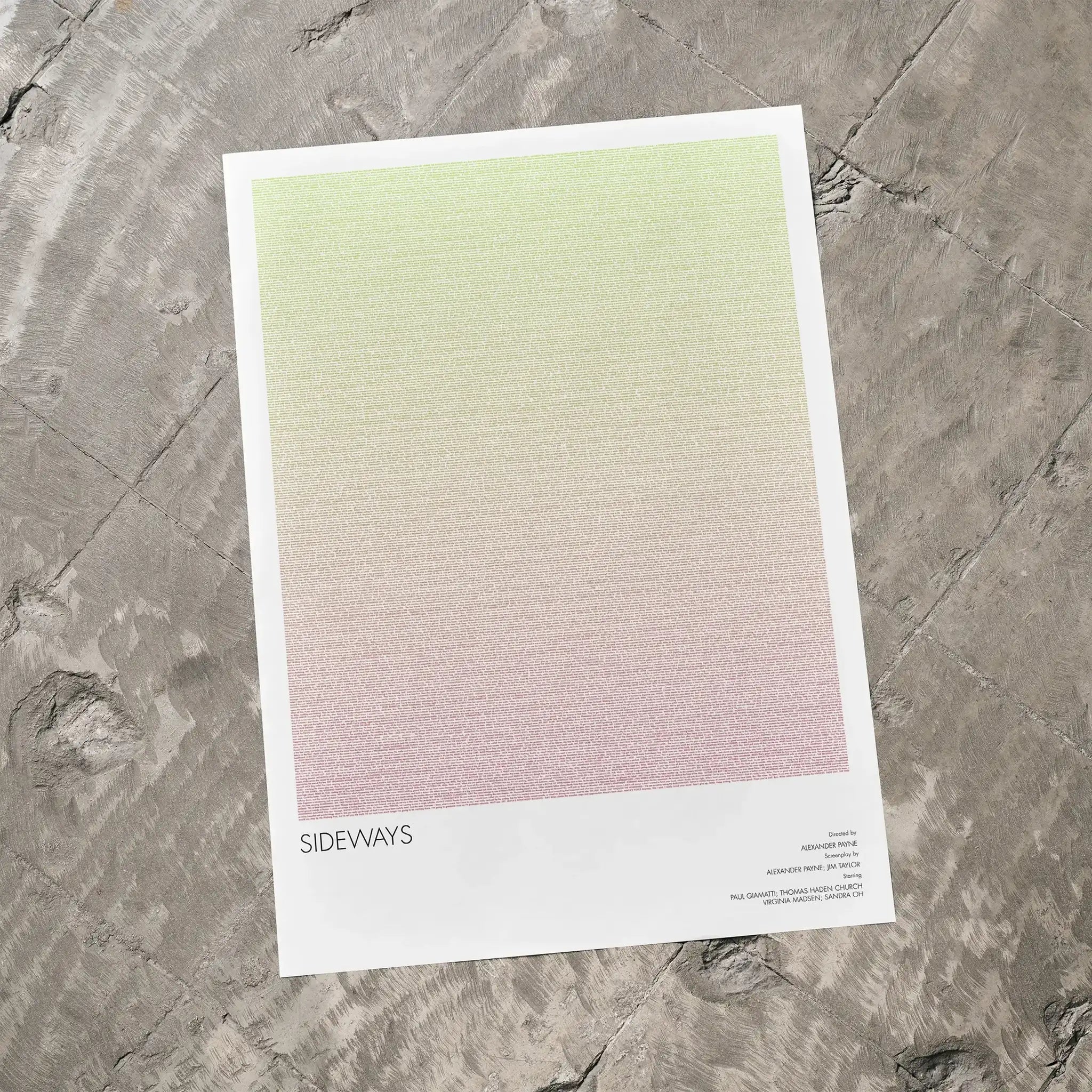 A Sideways movie script poster laid flat on a textured floor surface.