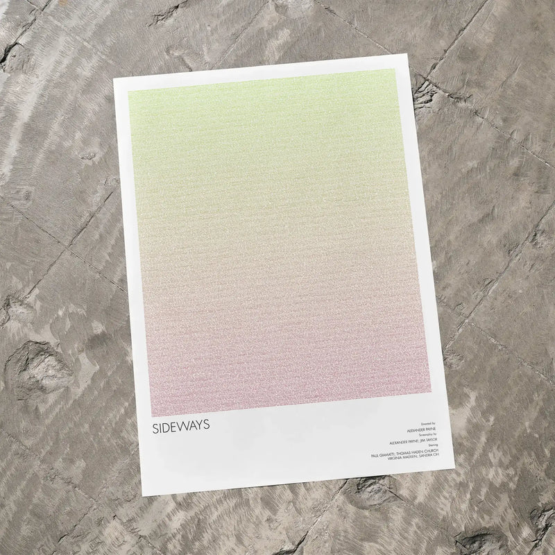 A Sideways movie script poster laid flat on a textured floor surface.