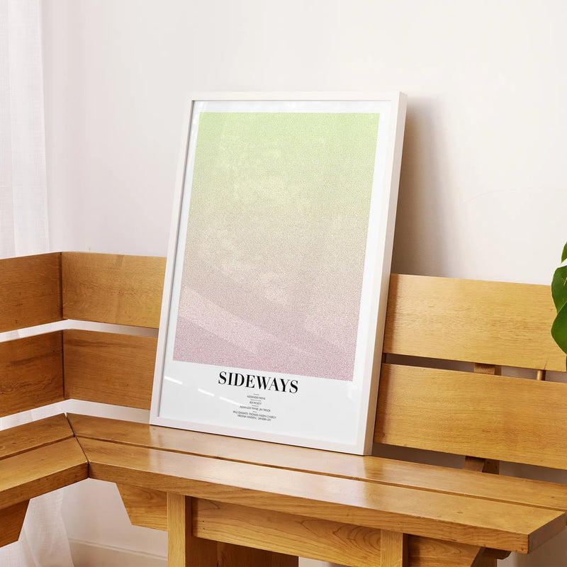 A framed Sideways movie script poster displayed on a sideboard in a contemporary space.