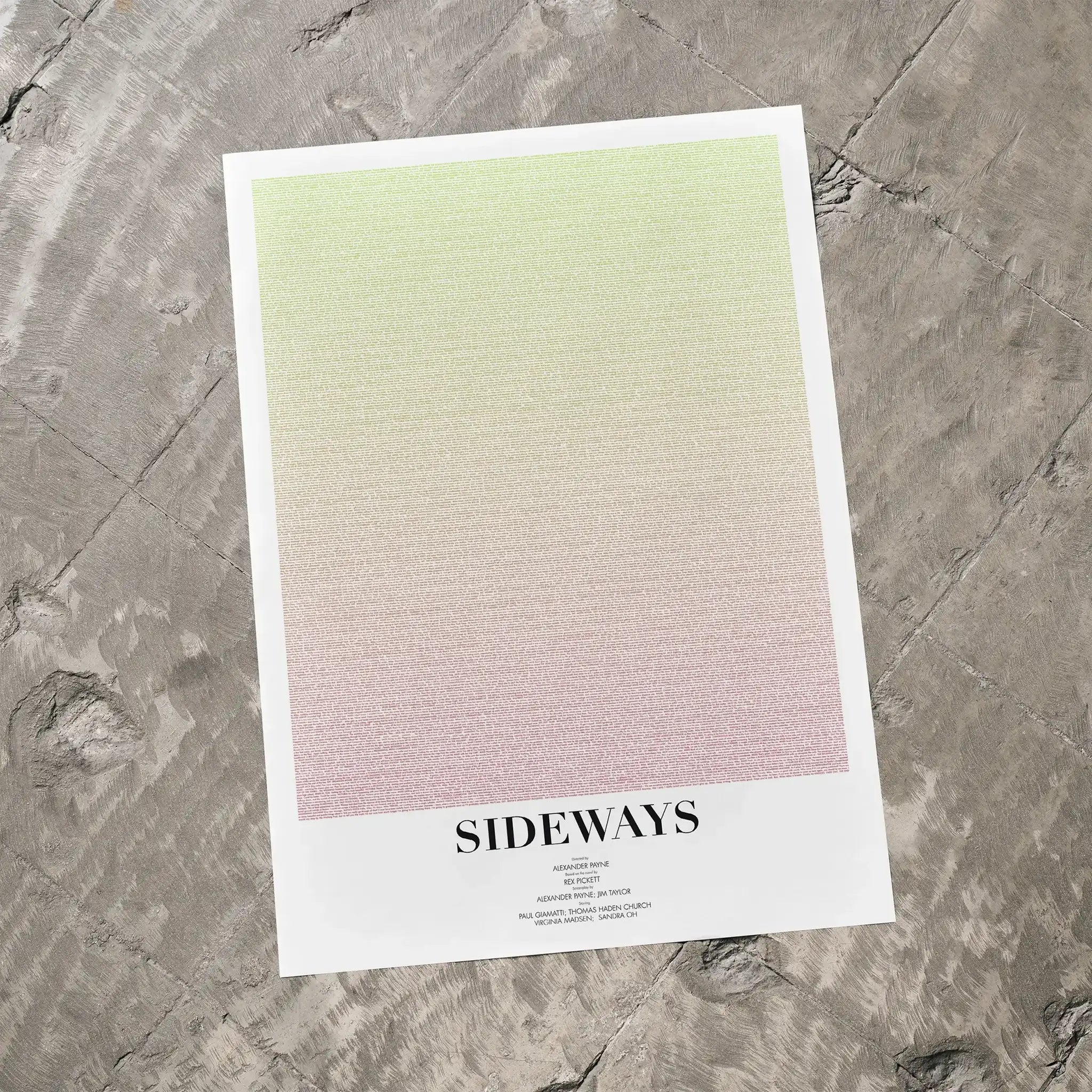 A Sideways movie script poster laid flat on a textured floor surface.