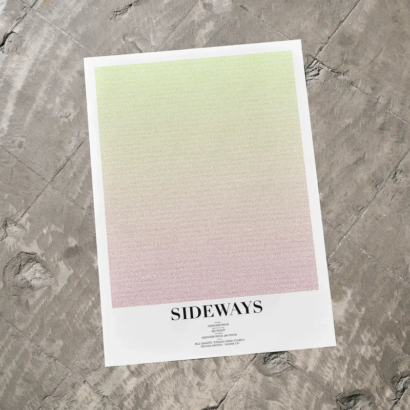A Sideways movie script poster laid flat on a textured floor surface.