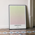 A framed Sideways movie script poster leaning against a wall in a minimalist interior.