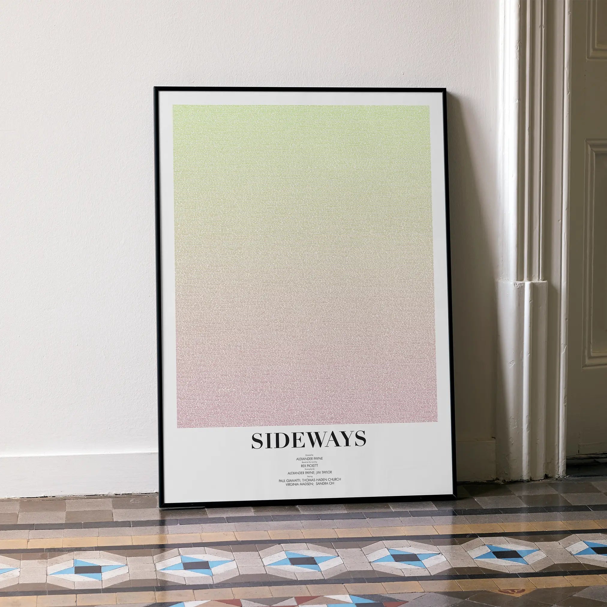 A framed Sideways movie script poster leaning against a wall in a minimalist interior.