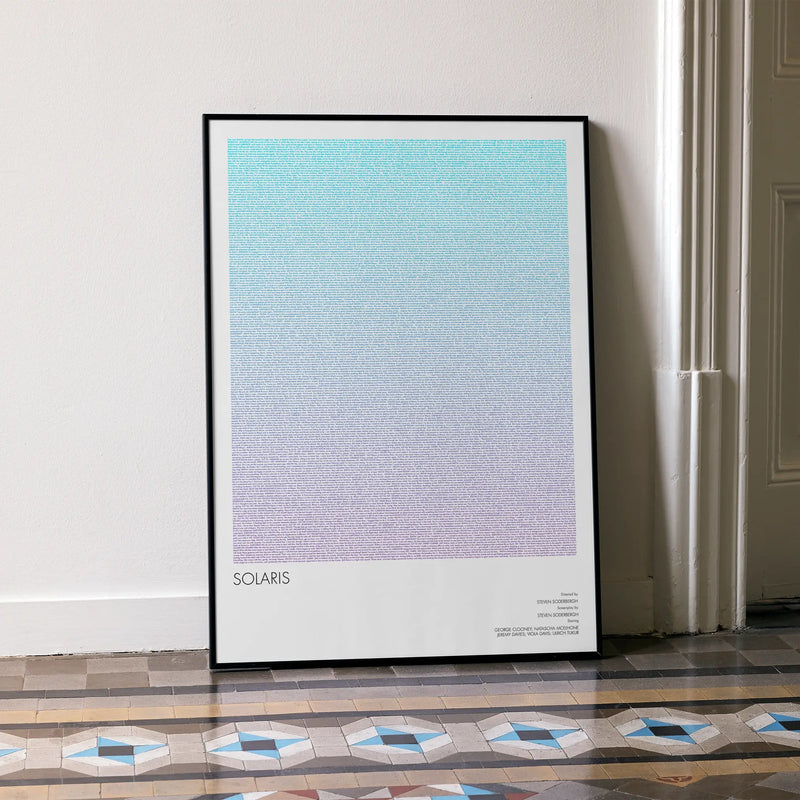 A framed Solaris movie script poster leaning against a wall in a minimalist interior.