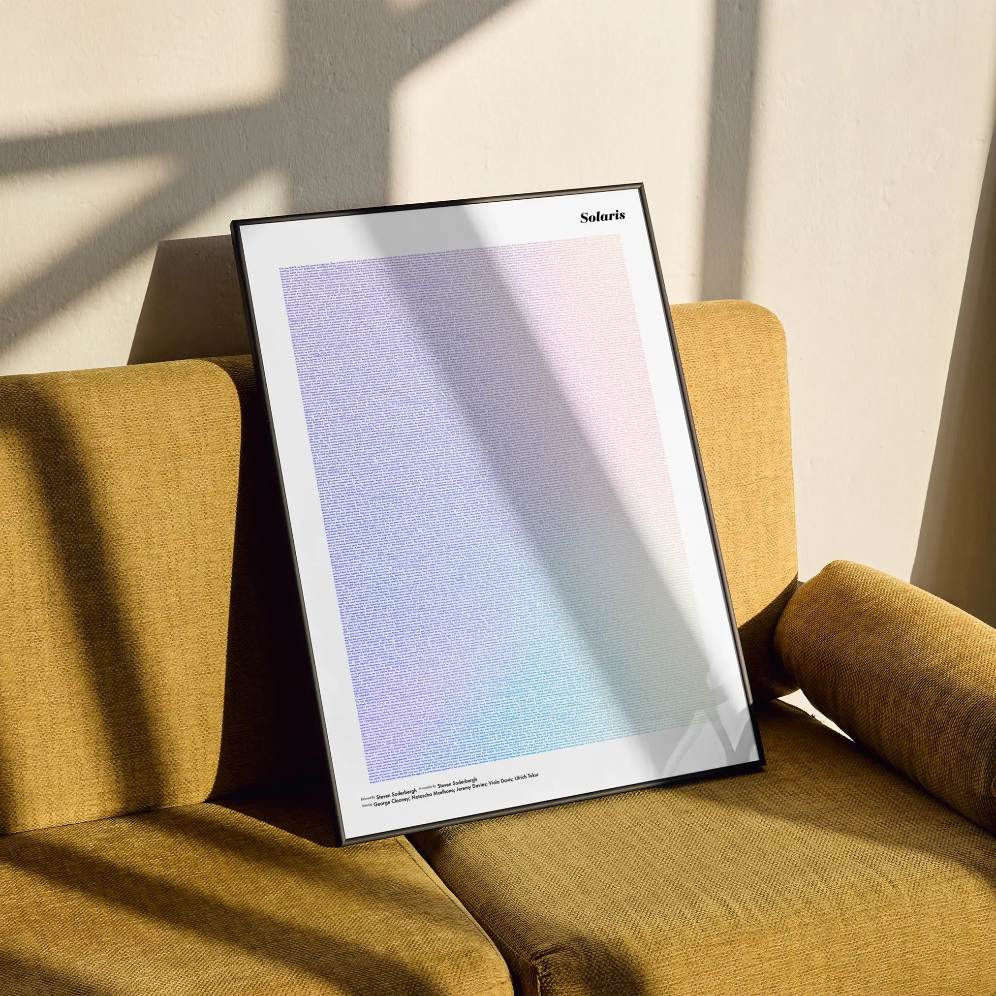 A framed Solaris movie script poster styled in a clean interior setting.