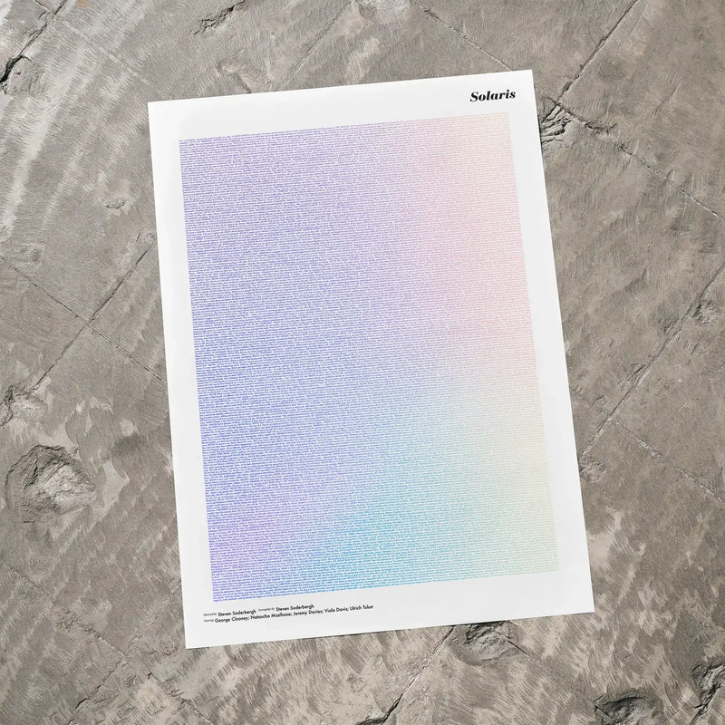 A Solaris movie script poster laid flat on a textured floor surface.