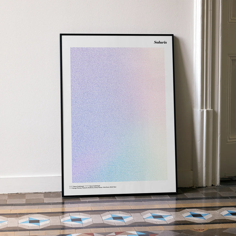 A framed Solaris movie script poster leaning against a wall in a minimalist interior.