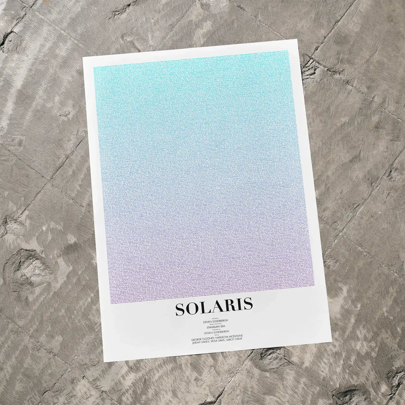 A Solaris movie script poster laid flat on a textured floor surface.