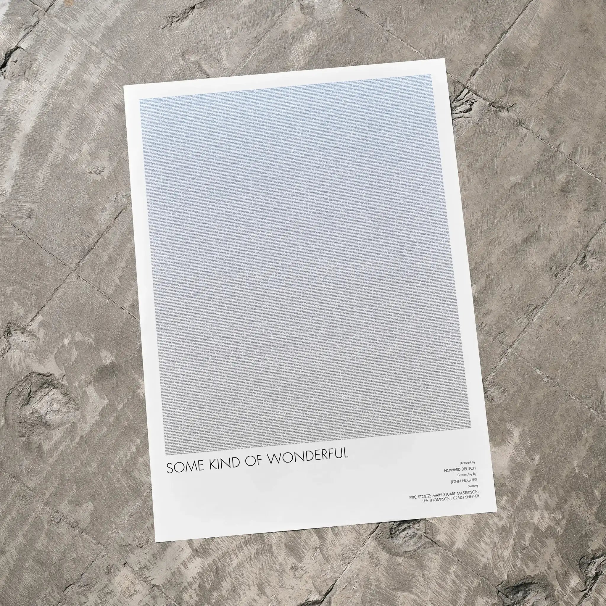 A Some Kind of Wonderful movie script poster laid flat on a textured floor surface.