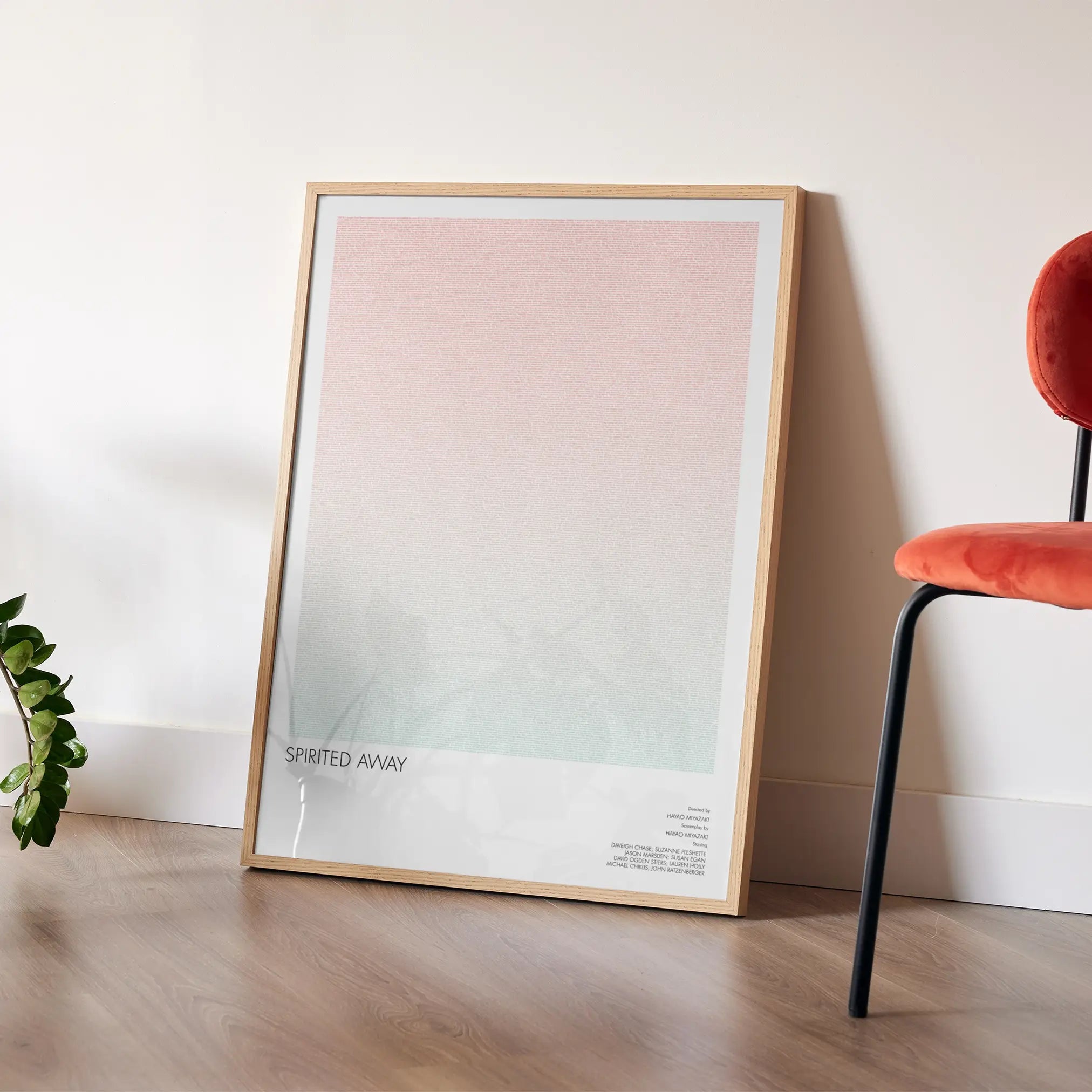 A framed Spirited Away movie script poster placed in a bright interior environment.