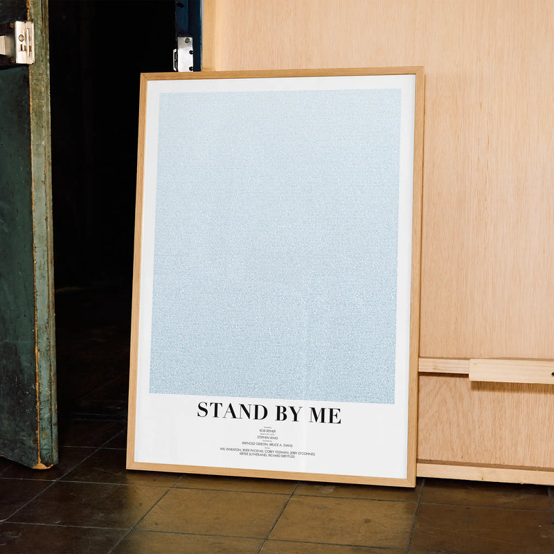 A framed Stand by Me movie script poster displayed in a contemporary interior setting.