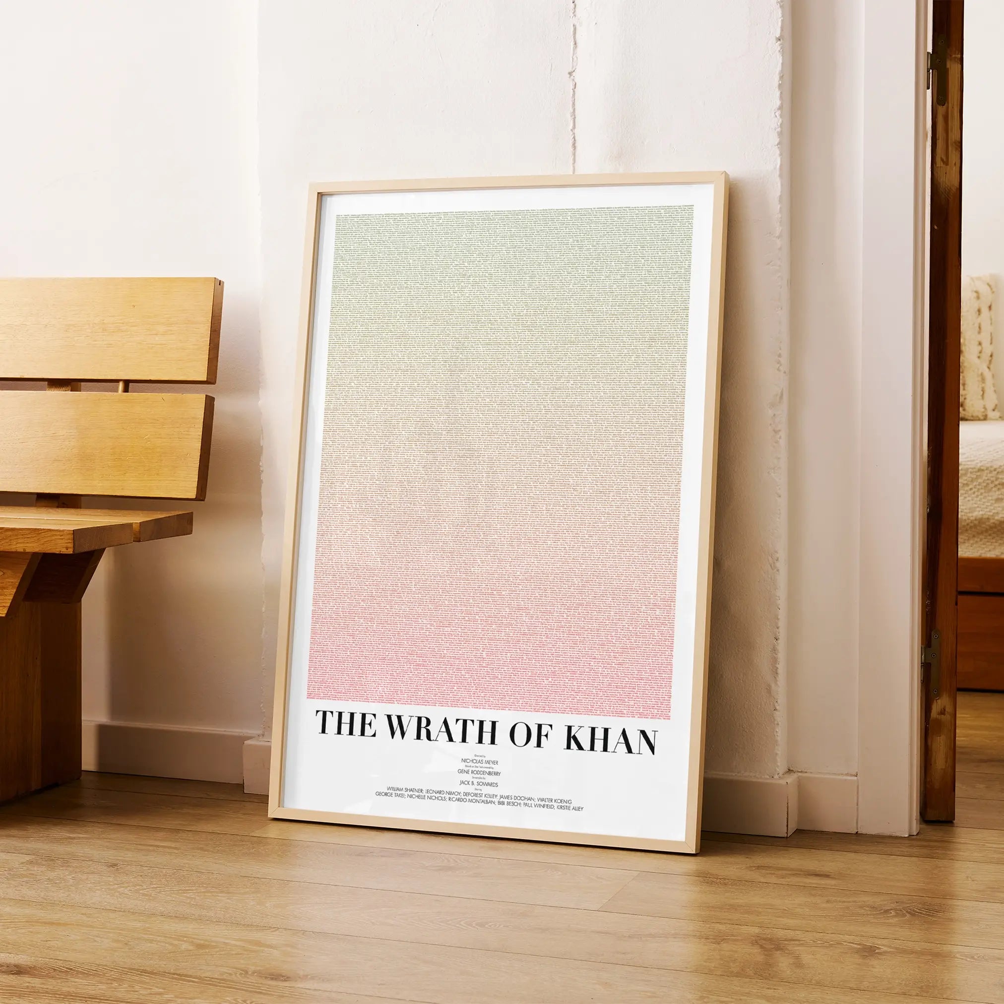 A framed Star Trek II: The Wrath of Khan movie script poster arranged in a minimalist interior setting.