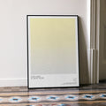 A framed Star Wars: A New Hope movie script poster leaning against a wall in a minimalist interior.