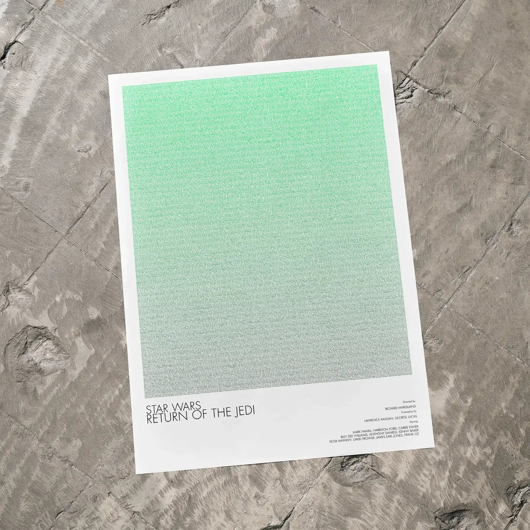 A Star Wars: Return of the Jedi movie script poster laid flat on a textured floor surface.