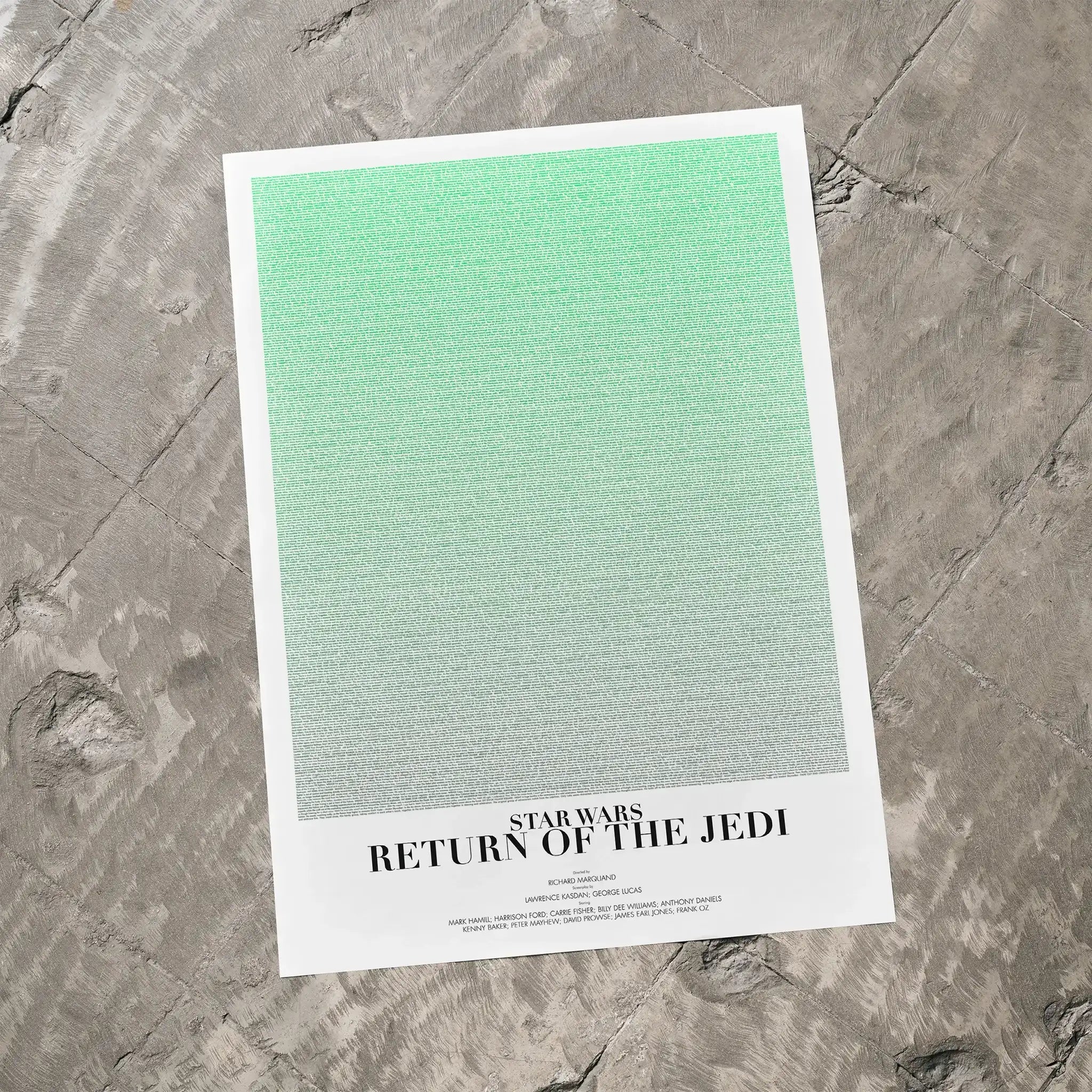 A Star Wars: Return of the Jedi movie script poster laid flat on a textured floor surface.