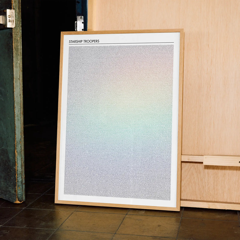 A framed Starship Troopers movie script poster displayed in a contemporary interior setting.