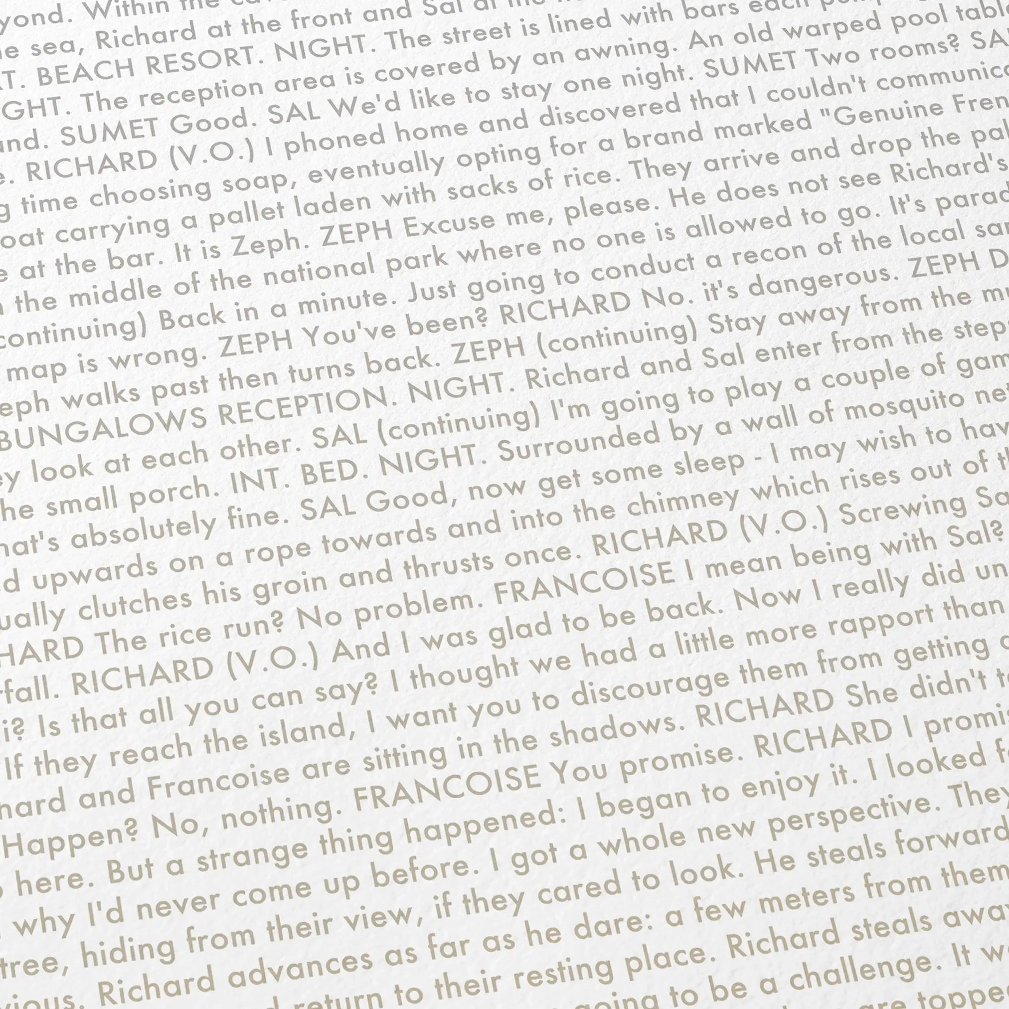 Close-up detail of the The Beach movie script poster showing dense typographic text.