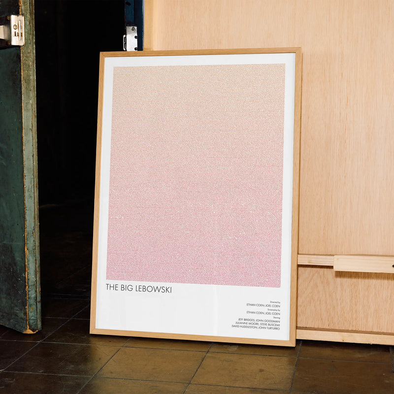 A framed The Big Lebowski movie script poster displayed in a contemporary interior setting.