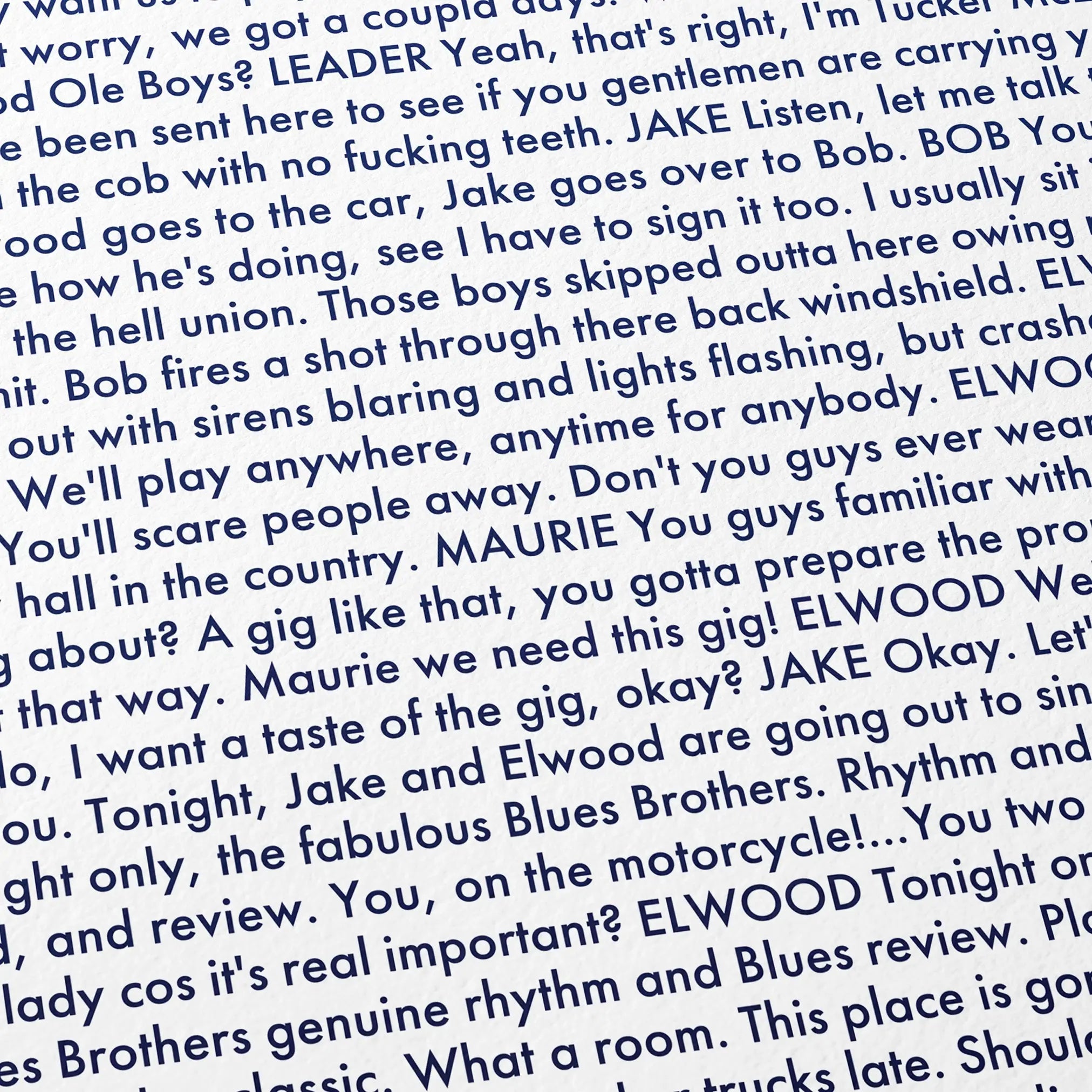 Close-up detail of the The Blues Brothers movie script poster showing dense typographic text.