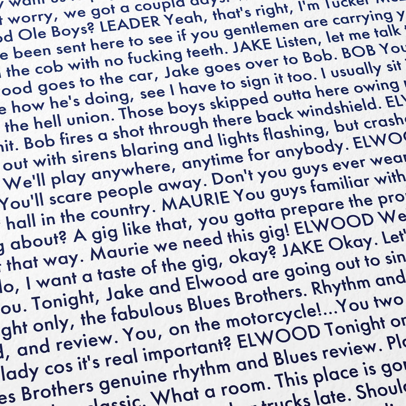 Close-up detail of the The Blues Brothers movie script poster showing dense typographic text.