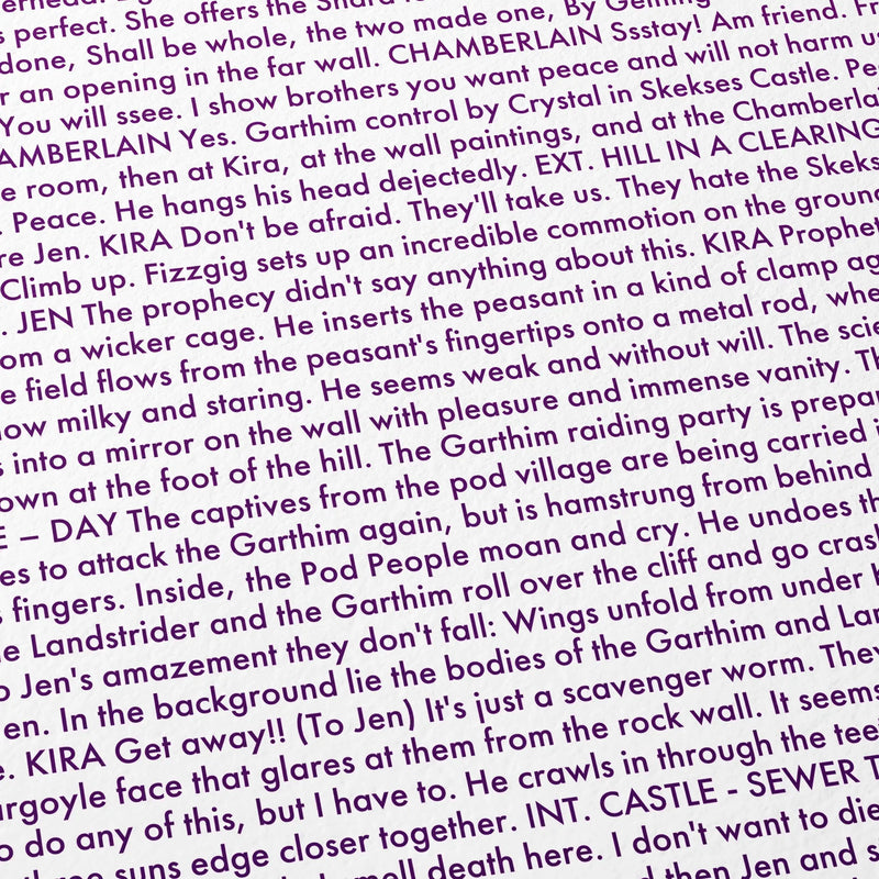 Close-up detail of the The Dark Crystal movie script poster showing dense typographic text.