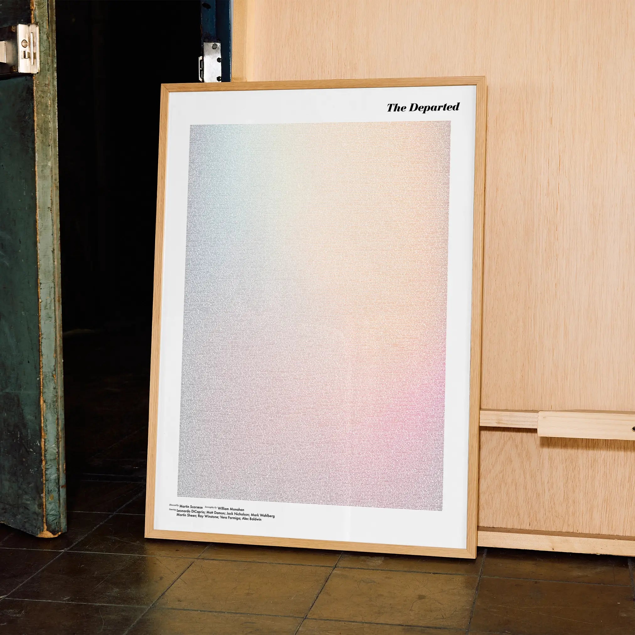 A framed The Departed movie script poster displayed in a contemporary interior setting.