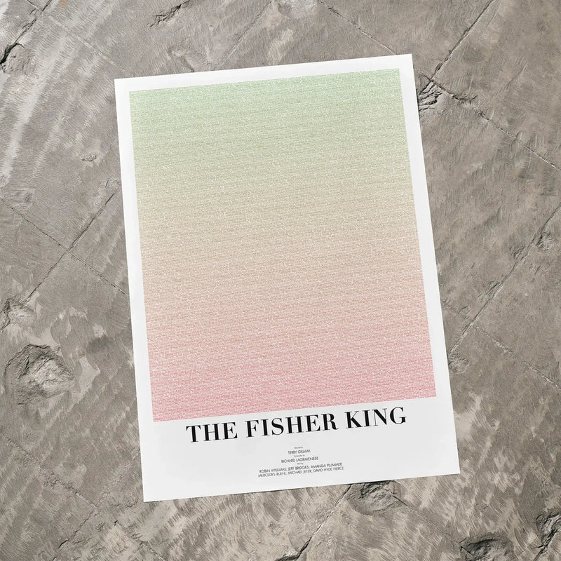 A The Fisher King movie script poster laid flat on a textured floor surface.
