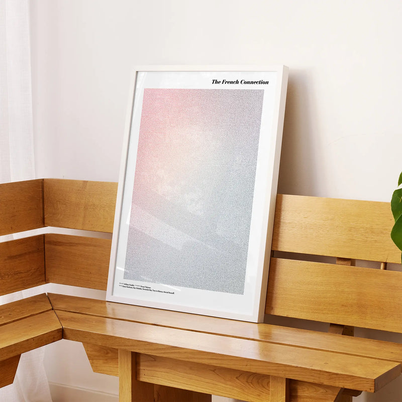A framed The French Connection movie script poster displayed on a sideboard in a contemporary space.